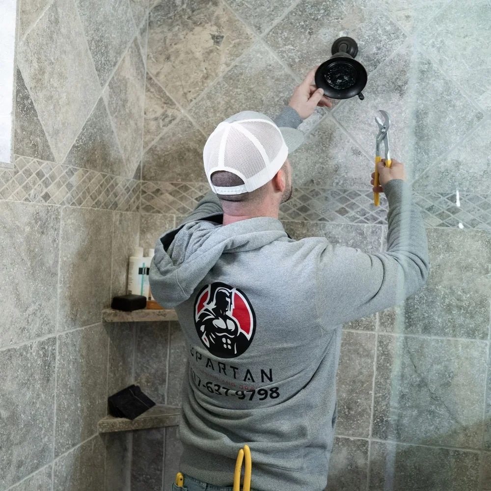 Professional water heater installation in a utility space