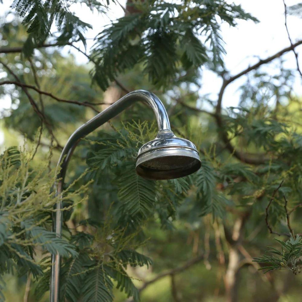 Outdoor shower installed in a backyard