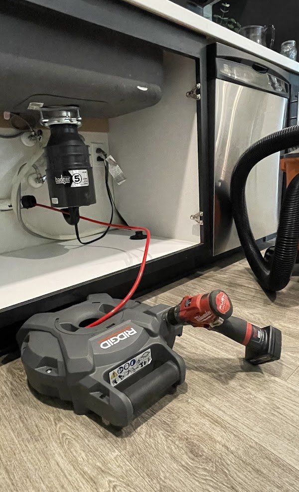 Kitchen sink cabinet during a plumbing service call